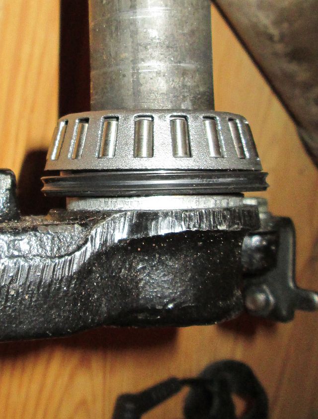 lower steering stem with bearings, seal then washer