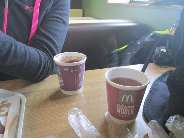 2 cups of steaming tea and coffee in a mcdonalds in cahors, france