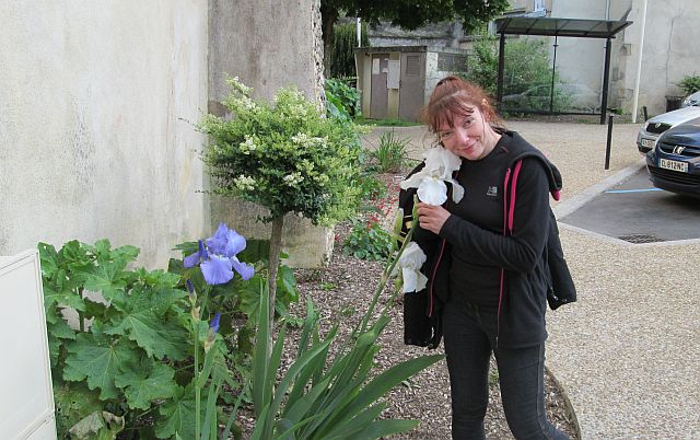 the gf hugs a large white flower