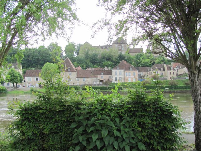 smart french houses and chateau seen from across the river at le blanc
