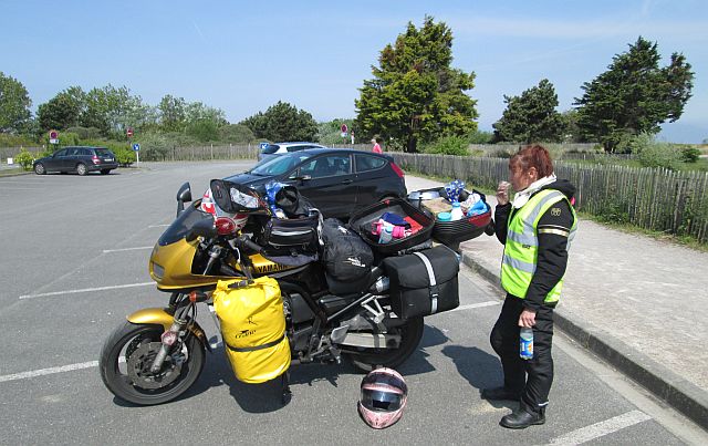The box open on the motorcycle, the gf eating butties all on the open windswept car park of the marina