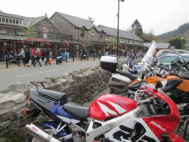 a line of motorcycles out front of the station at betws-y-coed