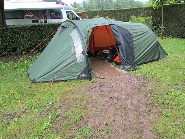 the tent with a trail of mud from the entrance to the pathway