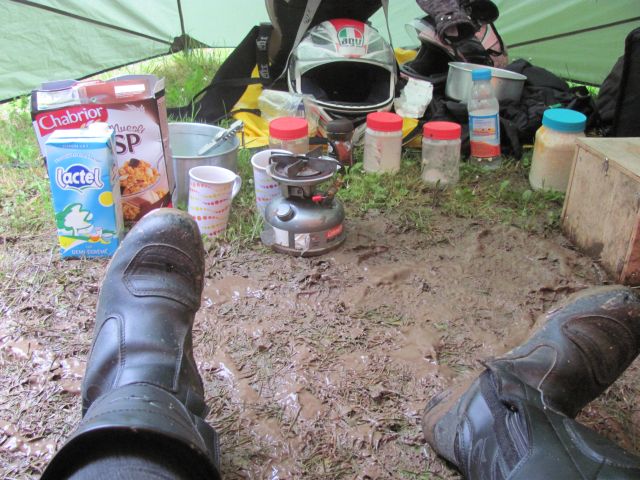 inside the porch of the tent the mud mixes with the camping gear