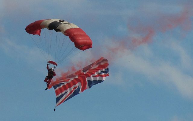 red devil sky diver with a large union jack flying beneath him