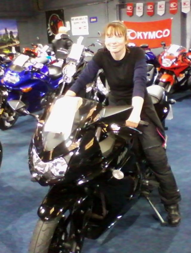 sharon sitting on a black ninja 300 sports bike