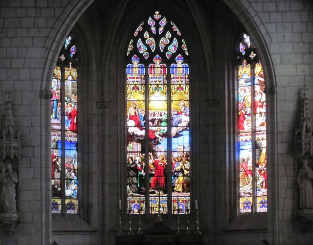 bright and colourful stained glass gothic windows of a church in chinon