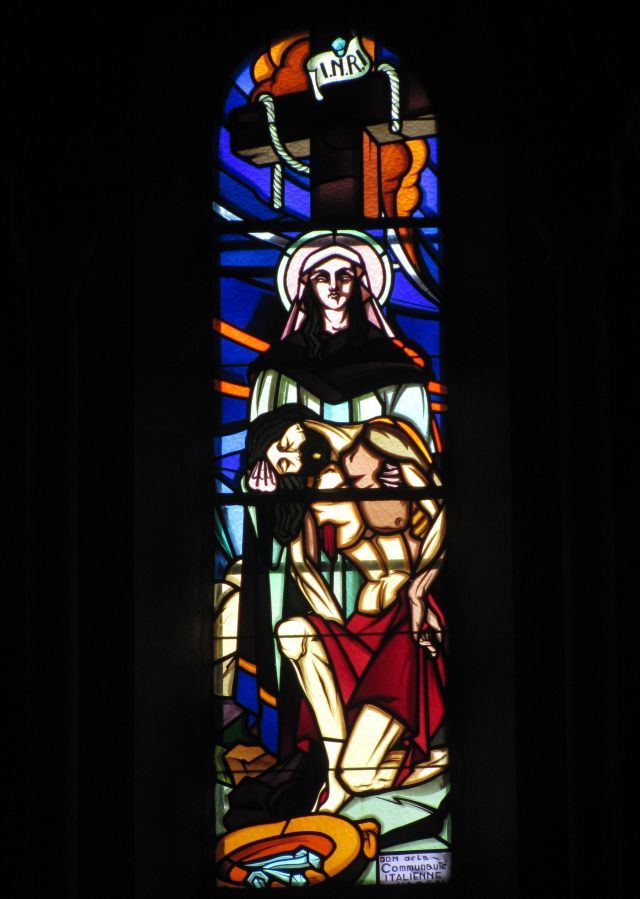 stained glass window showing christ after the cross