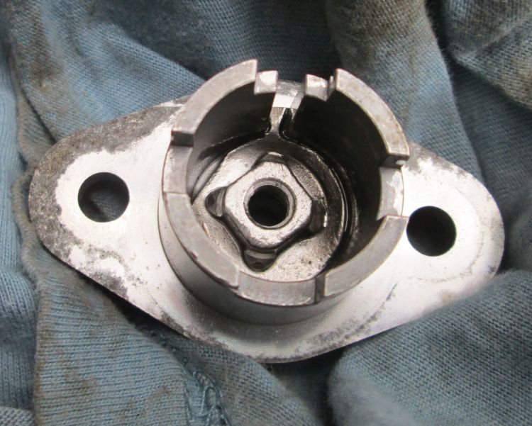 the camptive nut, rammed deep into the tensioner housing