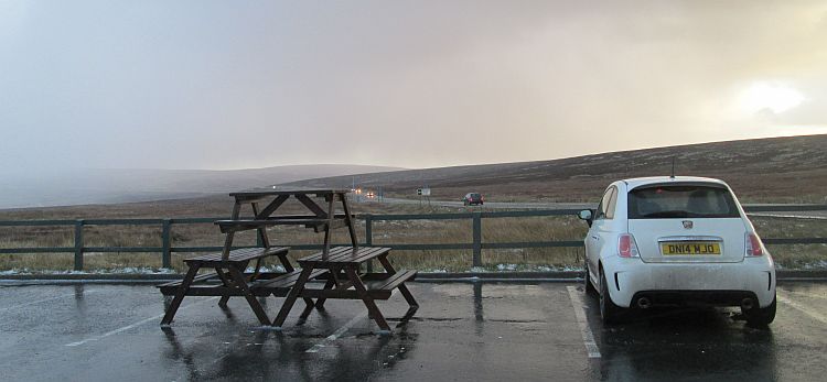 the cat and fiddle pub car park overlooking the cold, windswept and icy moors