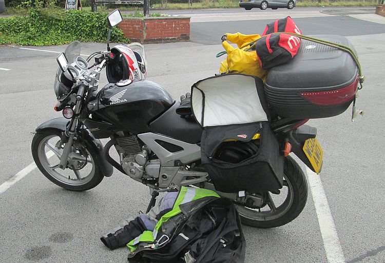 honda cbf 250 loaded up with luggage and camping gear