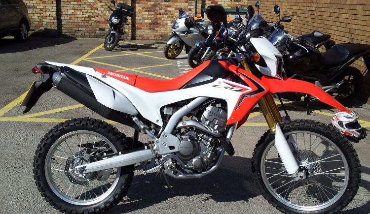 Honda's CRF250L. Off road style motorcycle in red and white