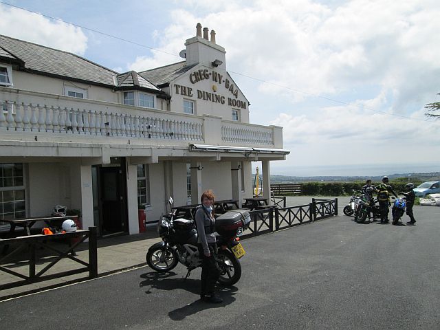 the gf and my cbf 250 outside the creg ny baa pub. A large white pub out in the countryside.