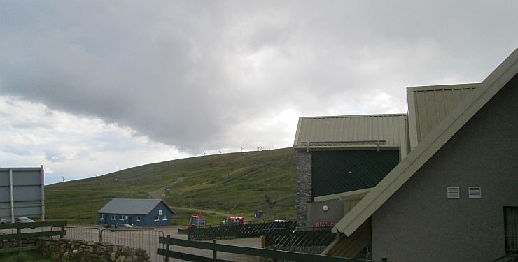the lecht ski centre with empty ski lifts, buildings and no snow at all