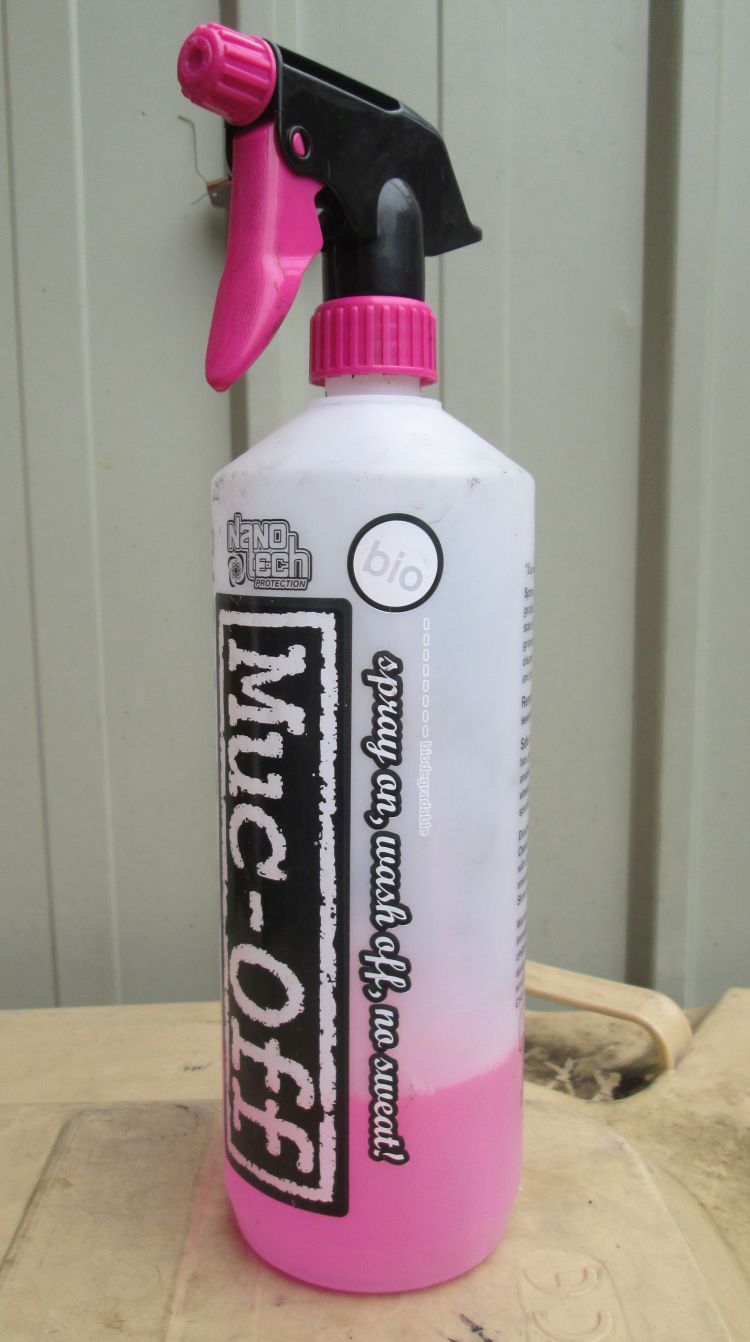 a bottle of the pink Muc-off bike cleaning solution with spray nozzle