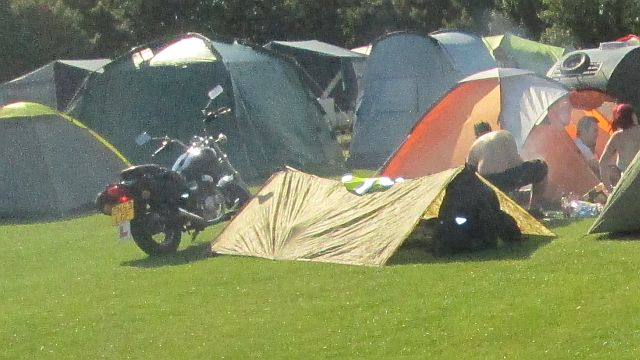 a simply nylon sheet with 2 poles, camping provisions for one rider