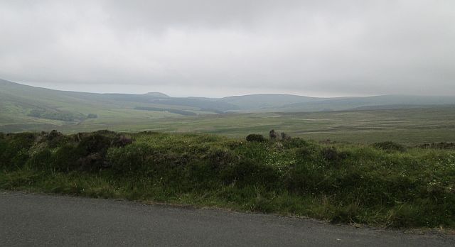 rolling hills set in the mist of the isle of man