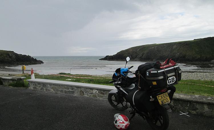 Ren's 125 stands beside the coastline of Ireland