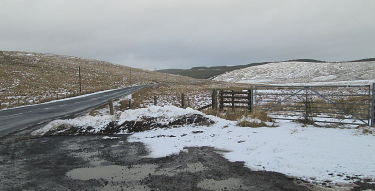 a thin layer of snow covers the hills around the A701 north of moffat