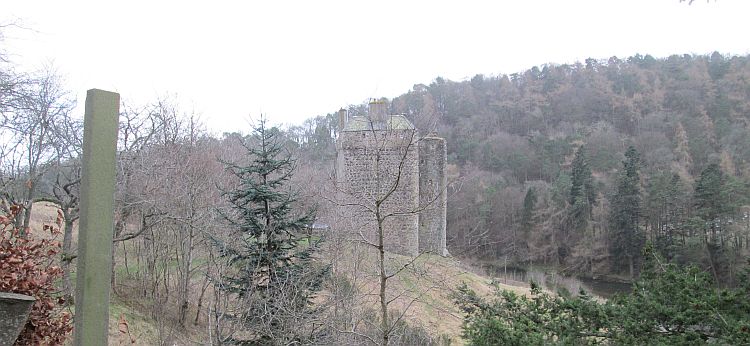 Neidpath castle just outside peebles. A tall stone building with minor fortifications