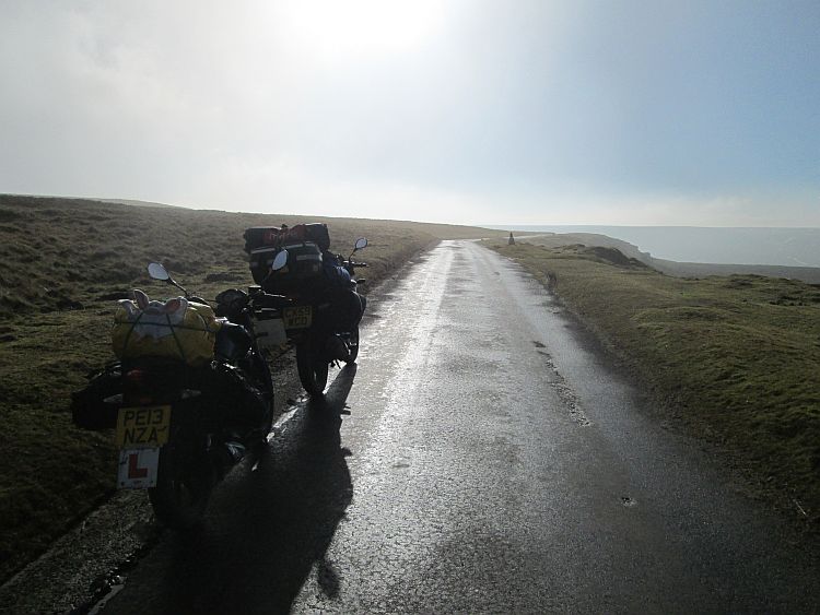 2 125cc motorcycles, one with L plates on a lonely Yorkshire moors road