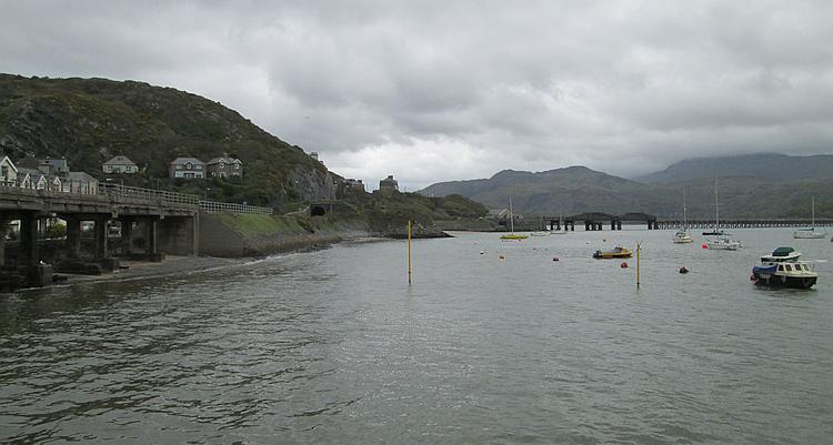 Hills, Barmouth harbour, a bridge and boats in the water