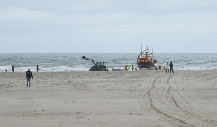 The Barmouth lifeboat sits on the sandy shoreline on Barmouth beach