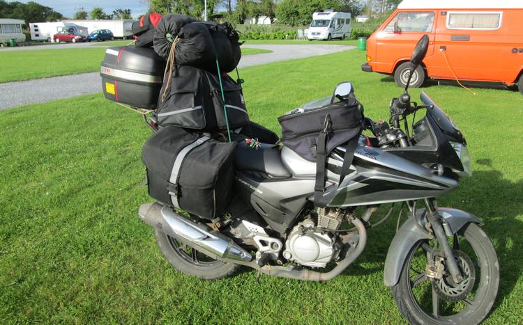Ren's honda cbf 125 fully loaded up with camping gear and luggage