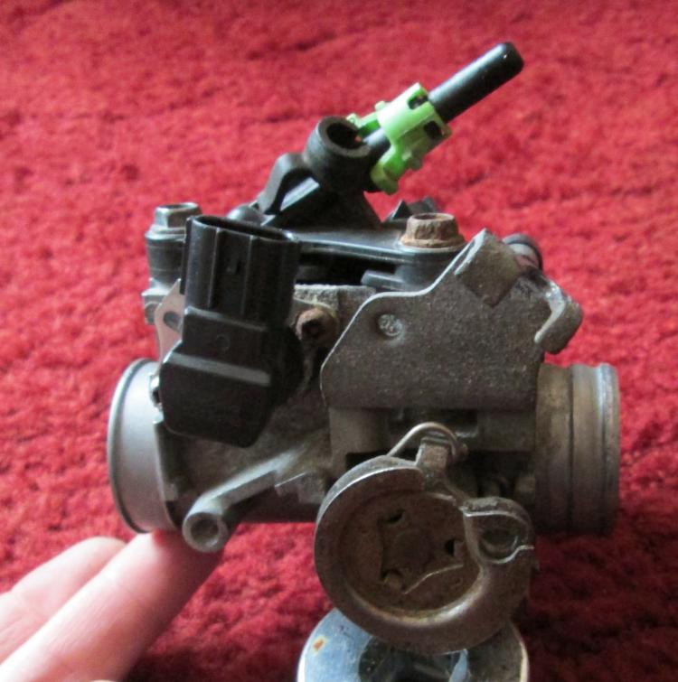 A fuel injection throttle body from a CBF 125