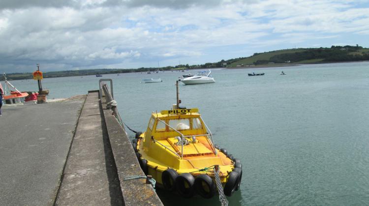 The yellow harbour pilot's boat in the pretty Youghal Harbour