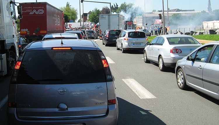 A line of cars and lorries in a traffic jam on a warm summer's day