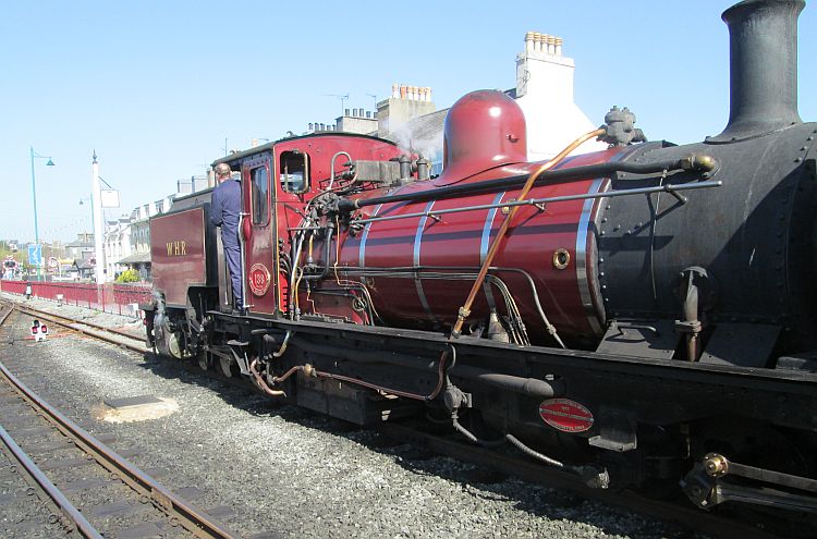 a burgundy narrow gauge steam engine at the welsh highland railway