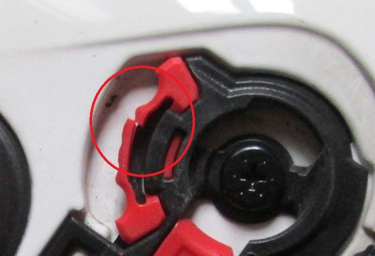 The pivot click with the broken part circled in red