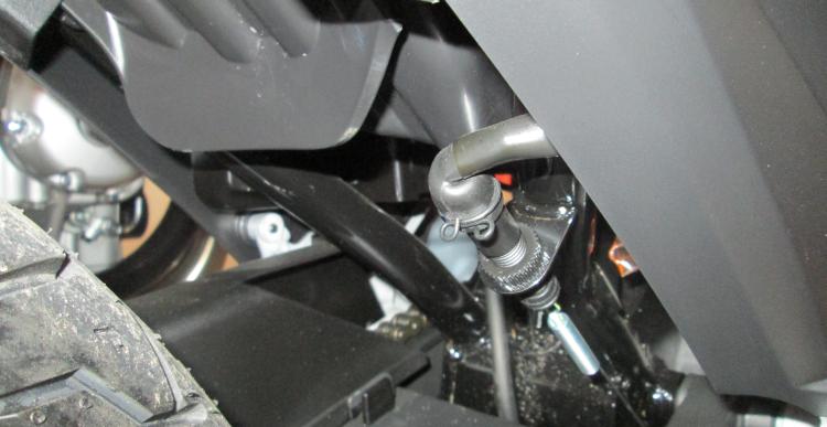 The position of the rear brake light switch, under the rear wheel arch