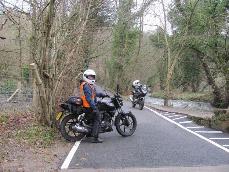 Sharon sits on her 125 after 20,000 miles with confidence