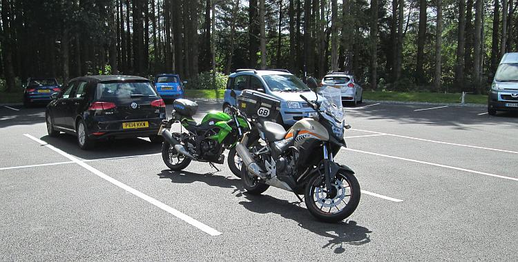 Ren and Sharon's motorcycles in the sun on a car park in The Lake District