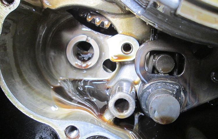 the milky and emulsified oil within the crankcase