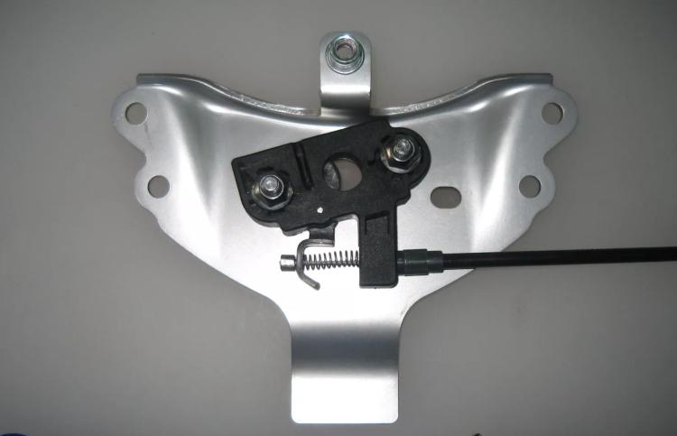 The bracket on the Street that holds the subframe halves together and the seat lock