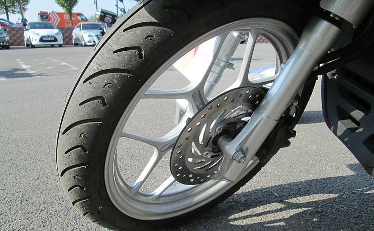The front brake and front wheel of Honda's scooter