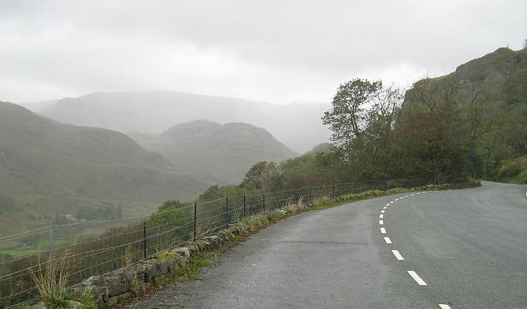 Welsh hills and mountains covered in a soggy wet mist seen from the road