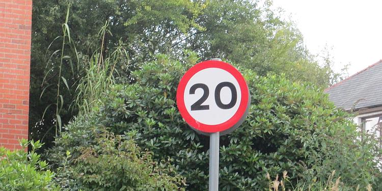 A sign showing a speed limit of 20 miles per hour
