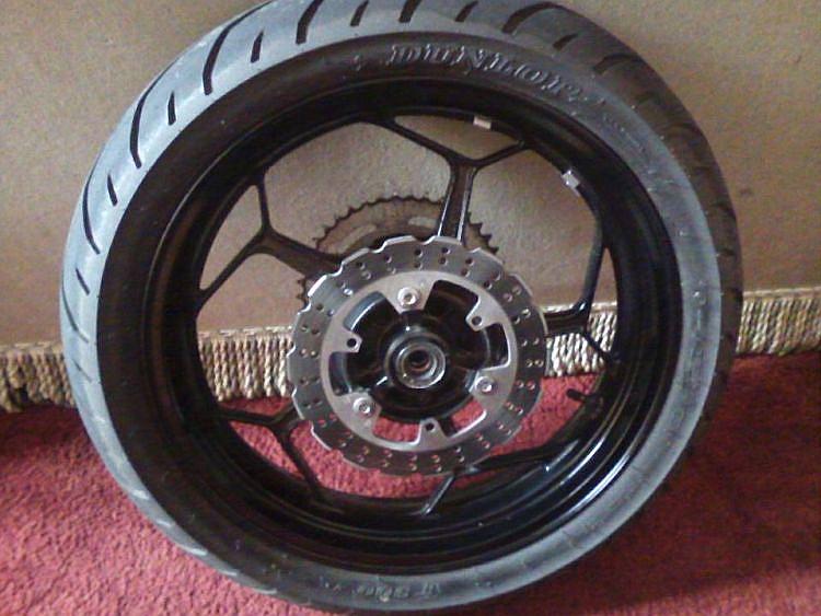 The removed rear wheel from Sharons bike bearing the deflated TT900 tyre