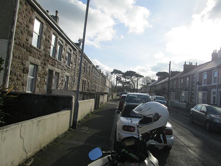 A regular street in camborne complete with houses and sun