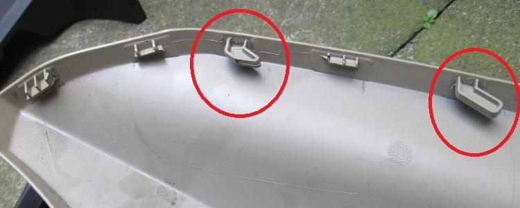 the 2 lugs or tabs that fix the fairing to the light binnacle
