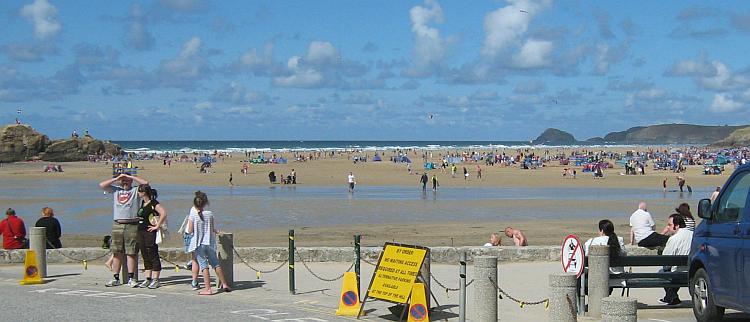 Perrnaporth's broad sandy beach filled with holiday makers in summer