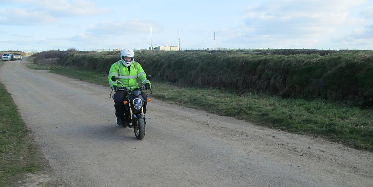 Ren in his high visibility jacket sat on the small but perfectly formed Grom 125