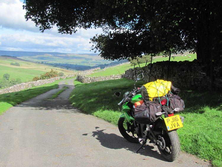 Sharon's 250 with luggage in a beautiful country lane near West Burton
