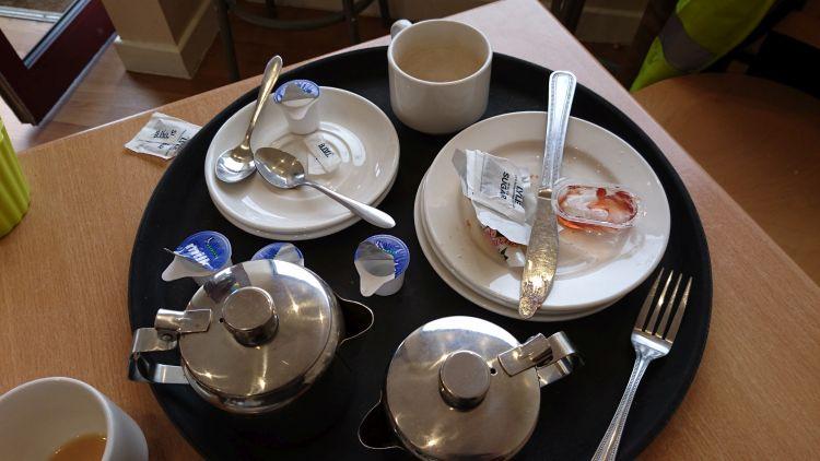 Our empty plates and tea pots on the table of the cafe