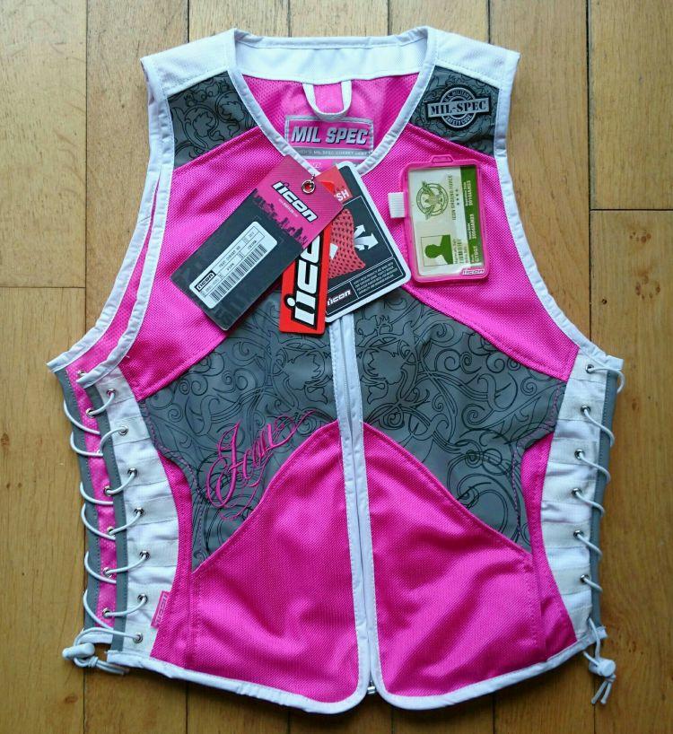 Icon's Mil-Spec vest in deep pink with lots of decorative designs on the reflective panels