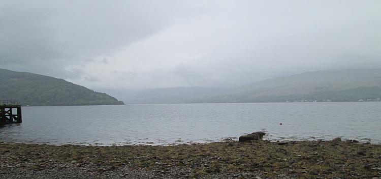 Looking out over Loch Fyne we see massive hills and mountains through the rain and mist
